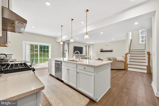 a white toilet sitting next to a shower