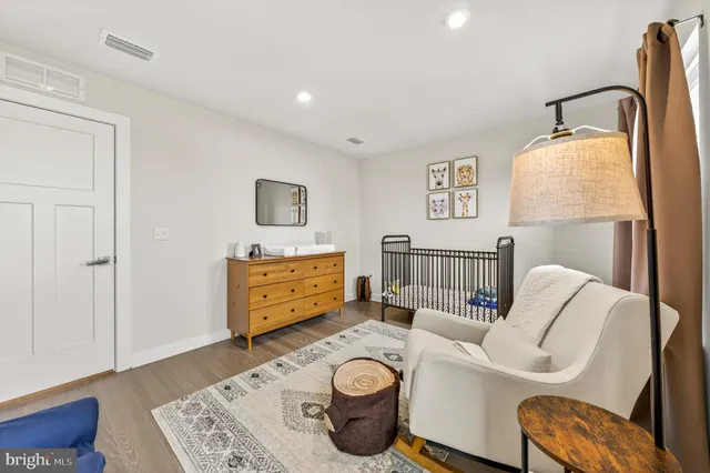 a bedroom with a bed and a couch