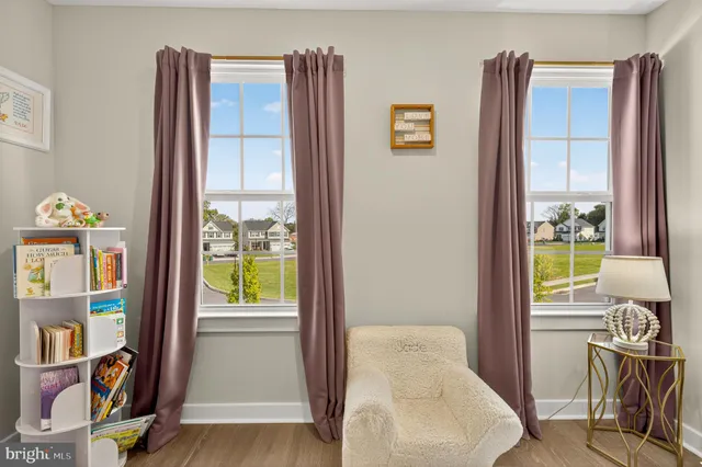 a bedroom with a bed and a lamp