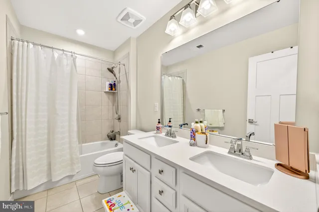 a bathroom with a sink vanity and mirror