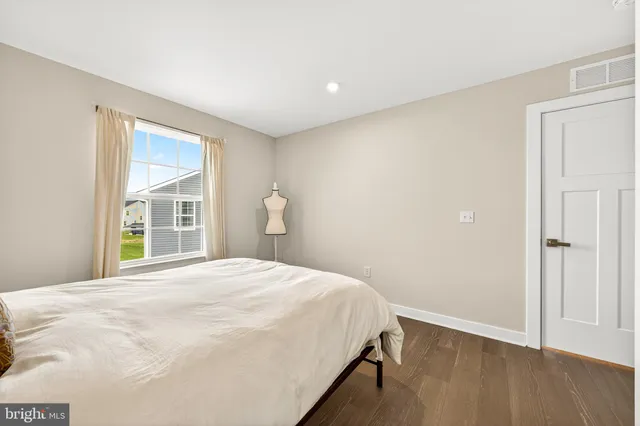 a white toilet sitting next to a shower