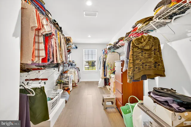 a view of a patio with table and chairs under an umbrella