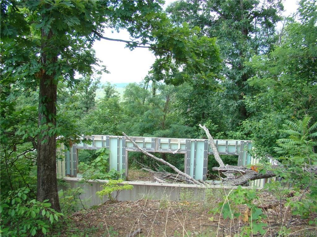 207 Side Road Bostic, NC 28018 - Photo 12 of 13 a view of house with large trees and playing ground