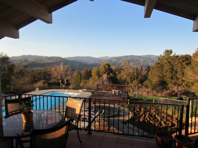 419 Poppy Hill Road Watsonville, CA 95076 - Photo 1 of 25 a view of a chairs and table on the roof deck