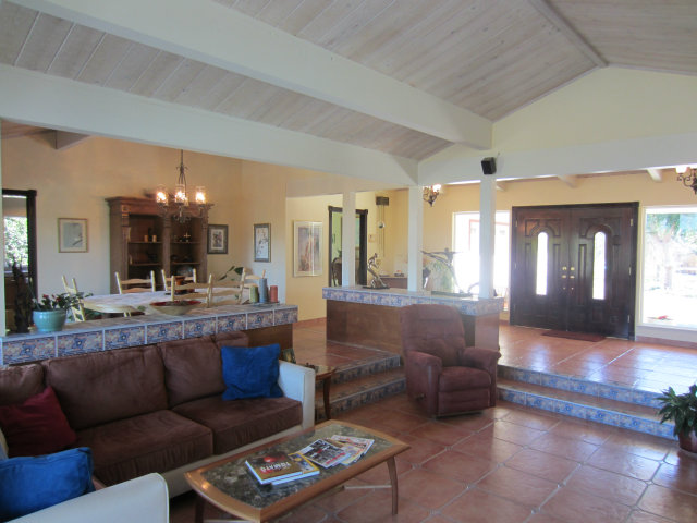 419 Poppy Hill Road Watsonville, CA 95076 - Photo 11 of 25 a living room with furniture and a chandelier