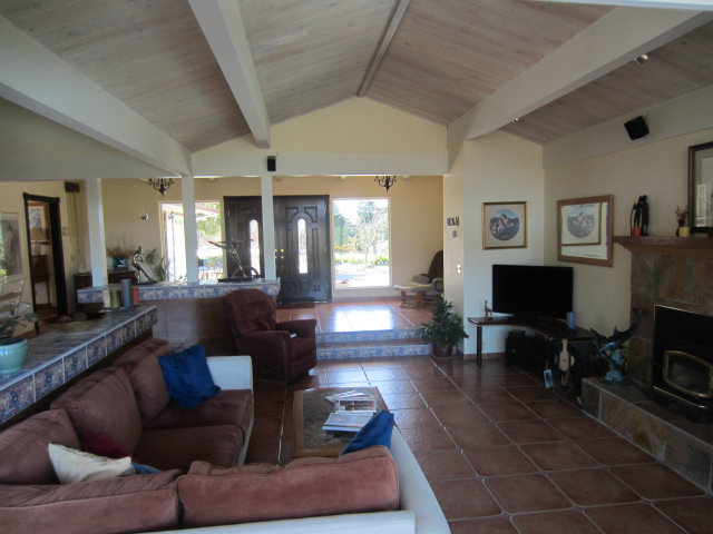 419 Poppy Hill Road Watsonville, CA 95076 - Photo 15 of 25 a living room with furniture and a flat screen tv