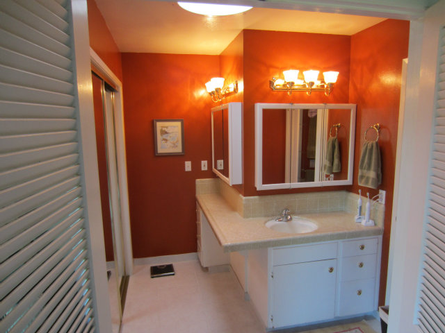 419 Poppy Hill Road Watsonville, CA 95076 - Photo 17 of 25 a bathroom with a sink a mirror and a shower