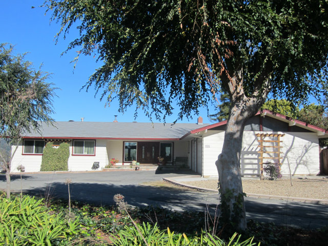 419 Poppy Hill Road Watsonville, CA 95076 - Photo 2 of 25 a house view with a garden space