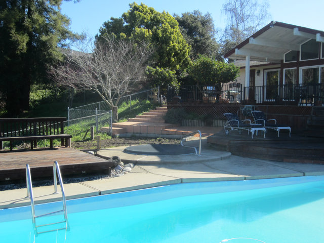 419 Poppy Hill Road Watsonville, CA 95076 - Photo 22 of 25 a view of backyard with swimming pool and seating space