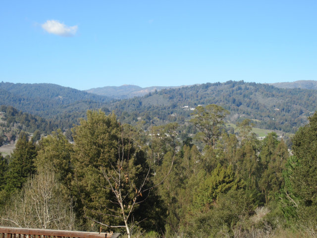 419 Poppy Hill Road Watsonville, CA 95076 - Photo 3 of 25 a view of a mountain range with trees in the background