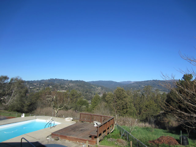 419 Poppy Hill Road Watsonville, CA 95076 - Photo 4 of 25 a view of a city with lush green forest