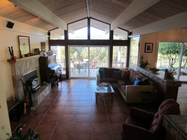 419 Poppy Hill Road Watsonville, CA 95076 - Photo 5 of 25 a living room with furniture and a fireplace