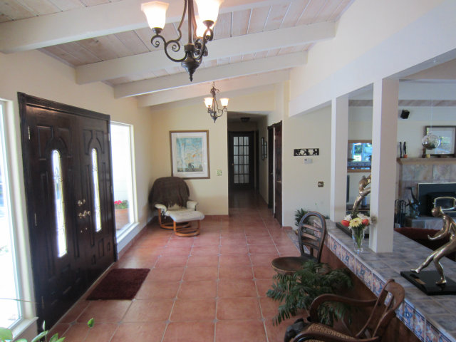 419 Poppy Hill Road Watsonville, CA 95076 - Photo 10 of 25 a living room with furniture and a chandelier