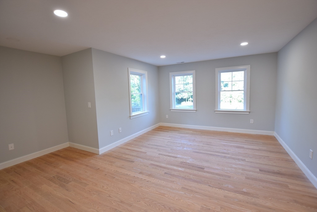 348 Boston Road Chelmsford, MA 01824 - Photo 14 of 42 an empty room with wooden floor and windows