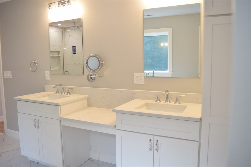 348 Boston Road Chelmsford, MA 01824 - Photo 28 of 42 a bathroom with a double vanity sink mirror and