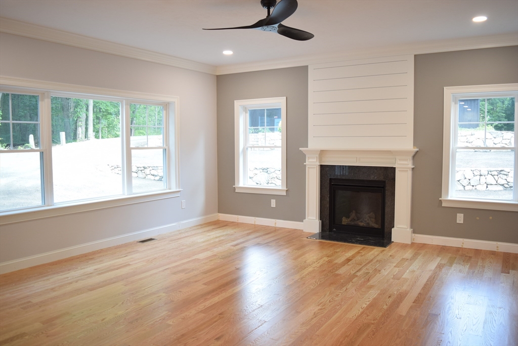 348 Boston Road Chelmsford, MA 01824 - Photo 7 of 42 a view of an empty room with wooden floor and a window