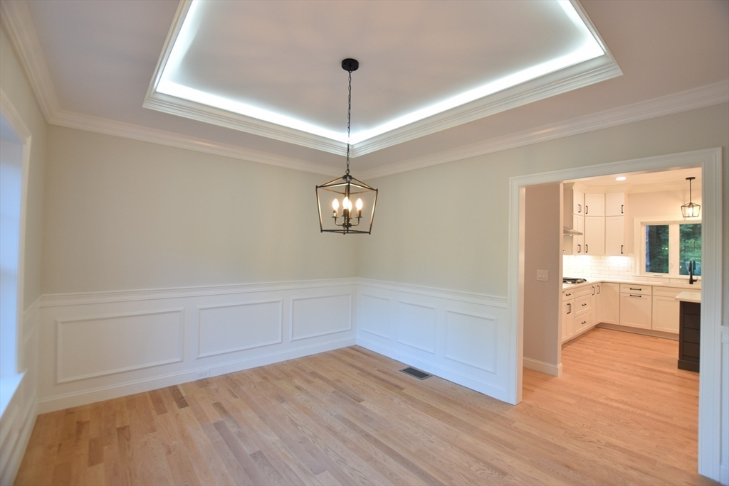 348 Boston Road Chelmsford, MA 01824 - Photo 9 of 42 a view of a room with wooden floor and windows