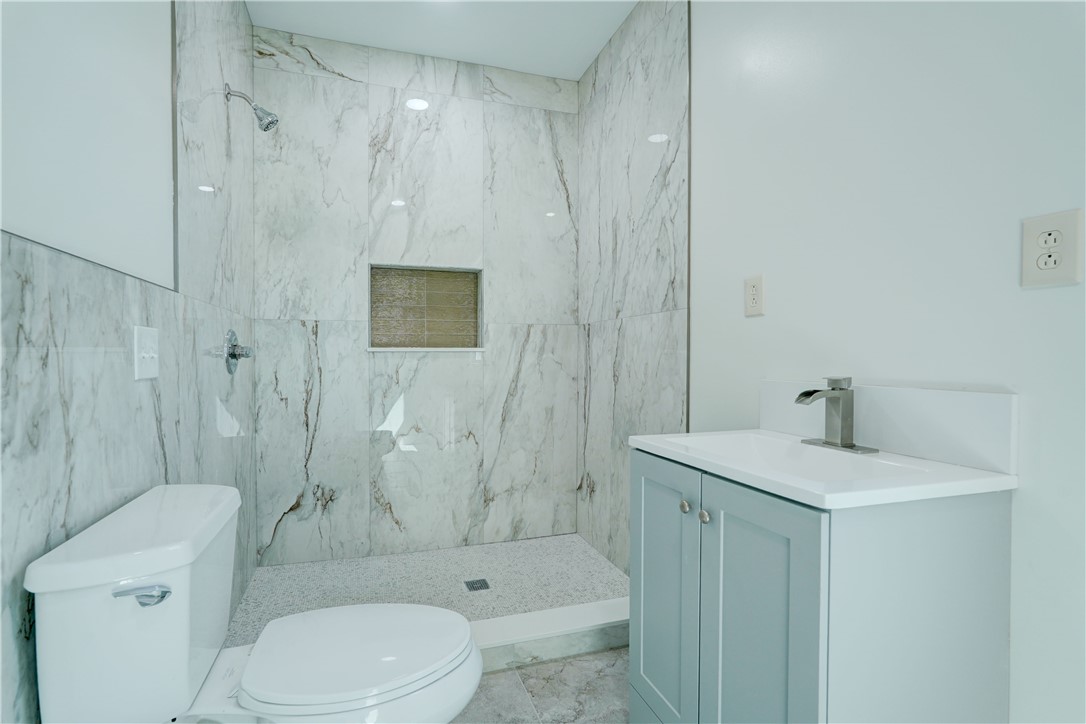 817 Ave D Rochester, NY 14621 - Photo 11 of 25 1st Floor Bathroom with Laundry