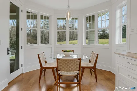 a dining room with furniture and window