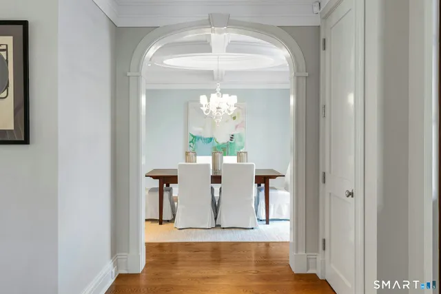 a view of a dining room with furniture and wooden floor
