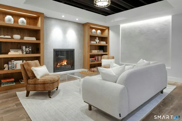 a living room with furniture and a fireplace