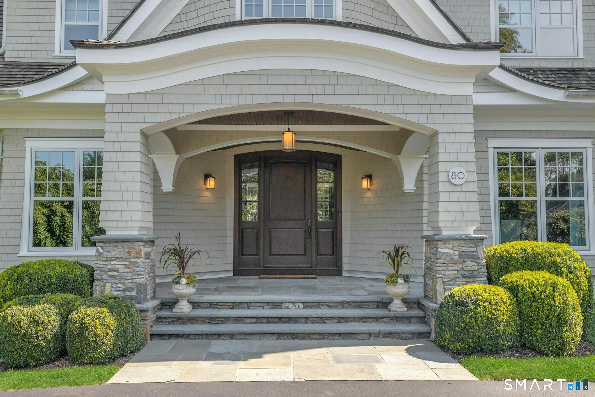 80 Compo Road North Westport, CT 06880 - Photo 5 of 40 a front view of a house with a garden