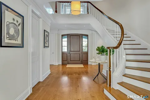 a view of an entryway with wooden floor