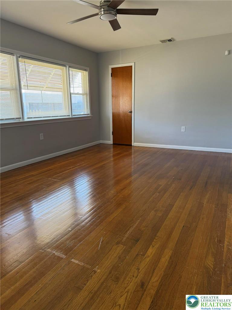 2229 Rodgers Street Bethlehem, PA 18017 - Photo 8 of 17 an empty room with wooden floor and windows