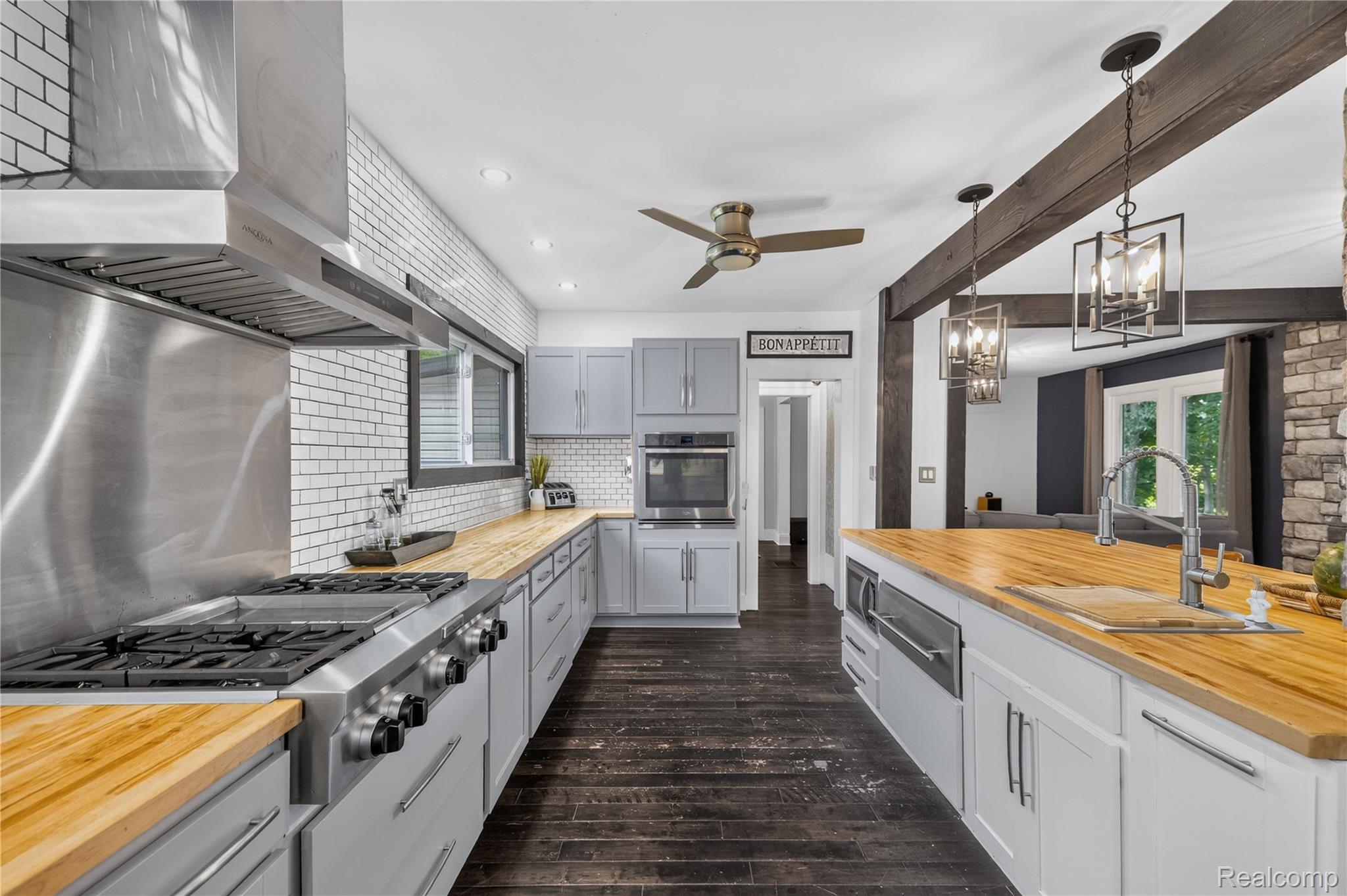 4860 Blue Bush Road Monroe, MI 48162 - Photo 15 of 59 Spacious kitchen featuring butcher block countertops, light grey cabinetry, and dark wood-finish flooring