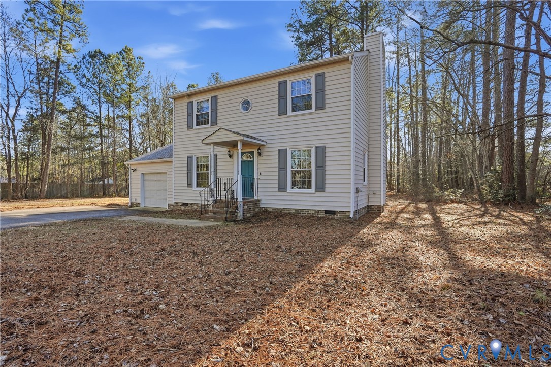 3605 Whitehouse Road Colonial Heights, VA 23834 - Photo 3 of 46 Colonial home with a chimney, driveway, and a gara