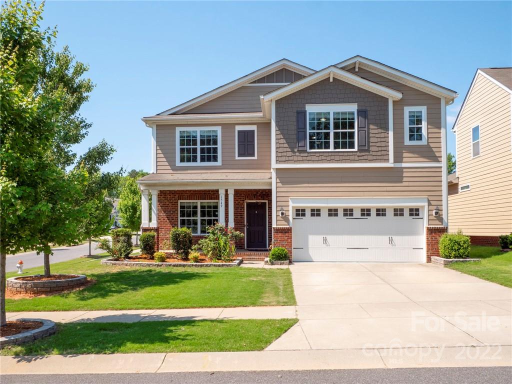 1549 Spring Blossom Trail Fort Mill, SC 29708 - Photo 2 of 45 a front view of a house with a yard