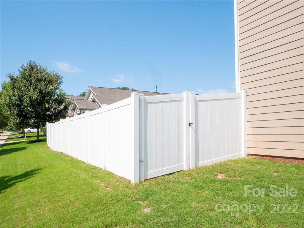 1549 Spring Blossom Trail Fort Mill, SC 29708 - Photo 5 of 45 a view of a backyard with flat screen tv
