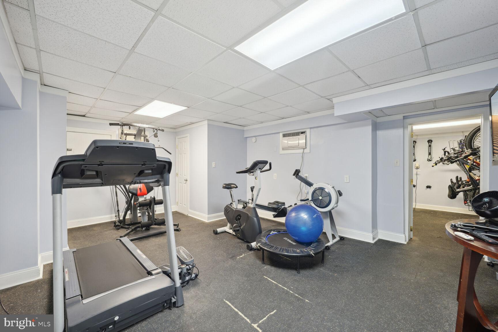 315 Evarts Street Northeast, Unit 210 Washington, DC 20002 - Photo 14 of 17 a room with gym equipment and a table