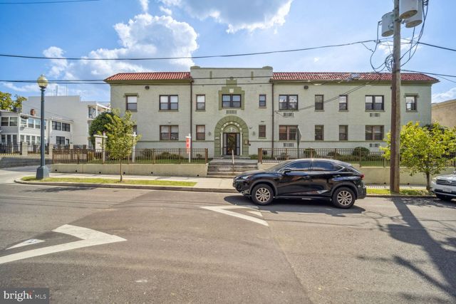 a view of a building with a street