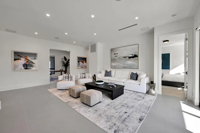 a bedroom with a bed and a flat screen television