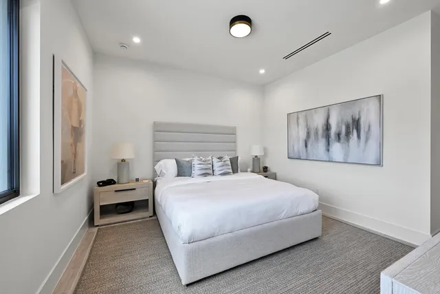 a view of a house with pool and sitting area