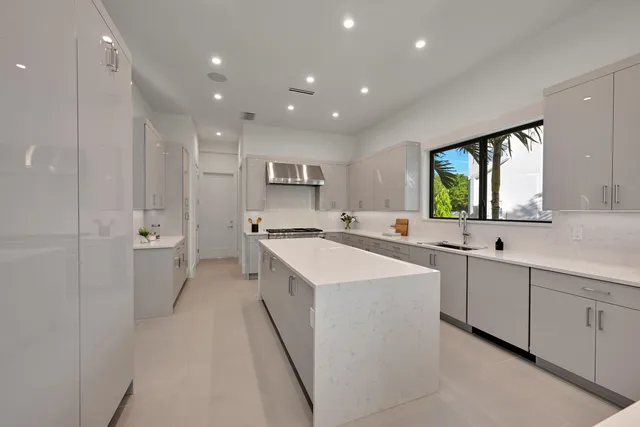 a kitchen with a sink stove and refrigerator