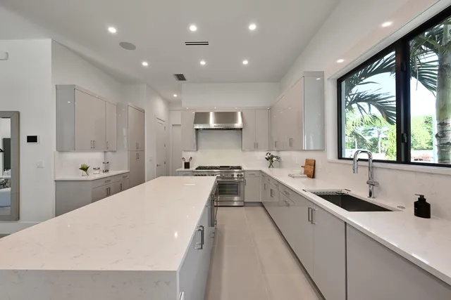 a kitchen with cabinets and appliances