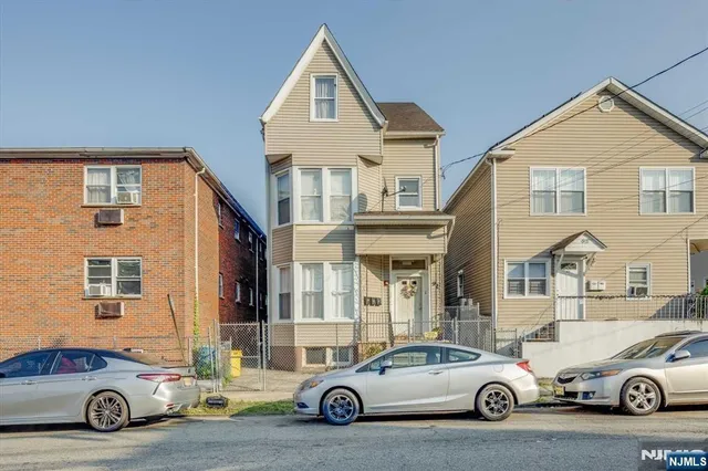 a car parked in front of a house