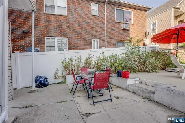 a view of a chairs and table in the patio