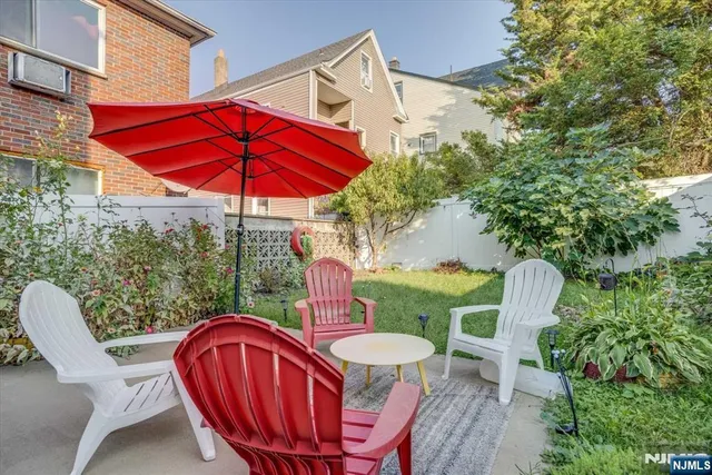 a view of a chairs and table in the patio