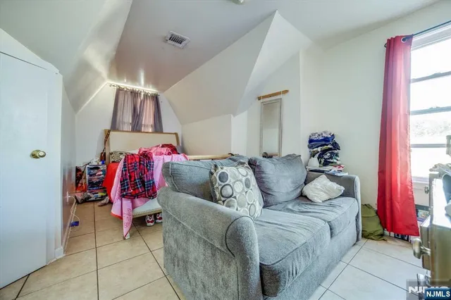 a bed room with a bed and a couch