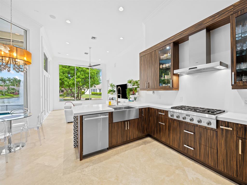 731 Coconut Palm Terrace Plantation, FL 33324 - Photo 15 of 48 a kitchen with stainless steel appliances granite countertop a stove a sink dishwasher and a refrigerator