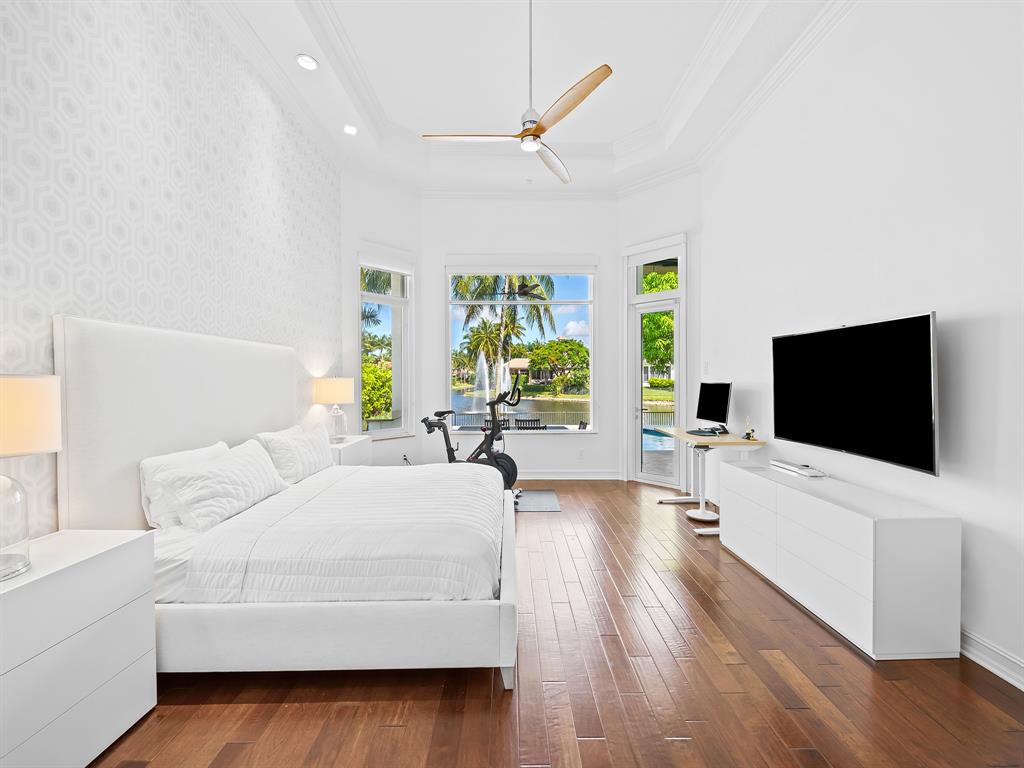 731 Coconut Palm Terrace Plantation, FL 33324 - Photo 18 of 48 a bedroom with a bed and a flat screen tv