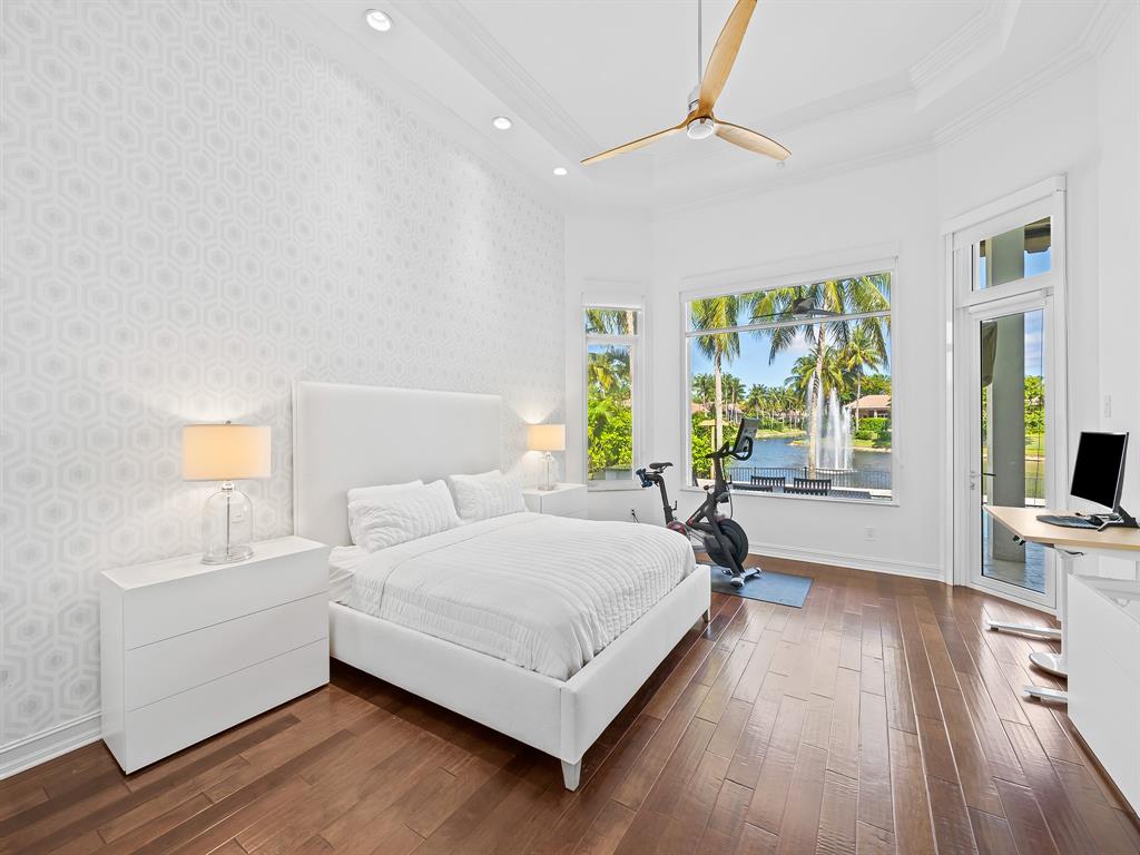 731 Coconut Palm Terrace Plantation, FL 33324 - Photo 19 of 48 a bedroom with a bed and a large window