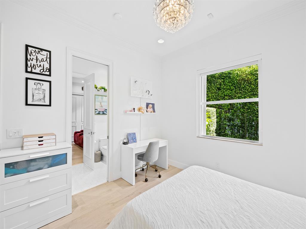 731 Coconut Palm Terrace Plantation, FL 33324 - Photo 22 of 48 a bedroom with a bed and a window