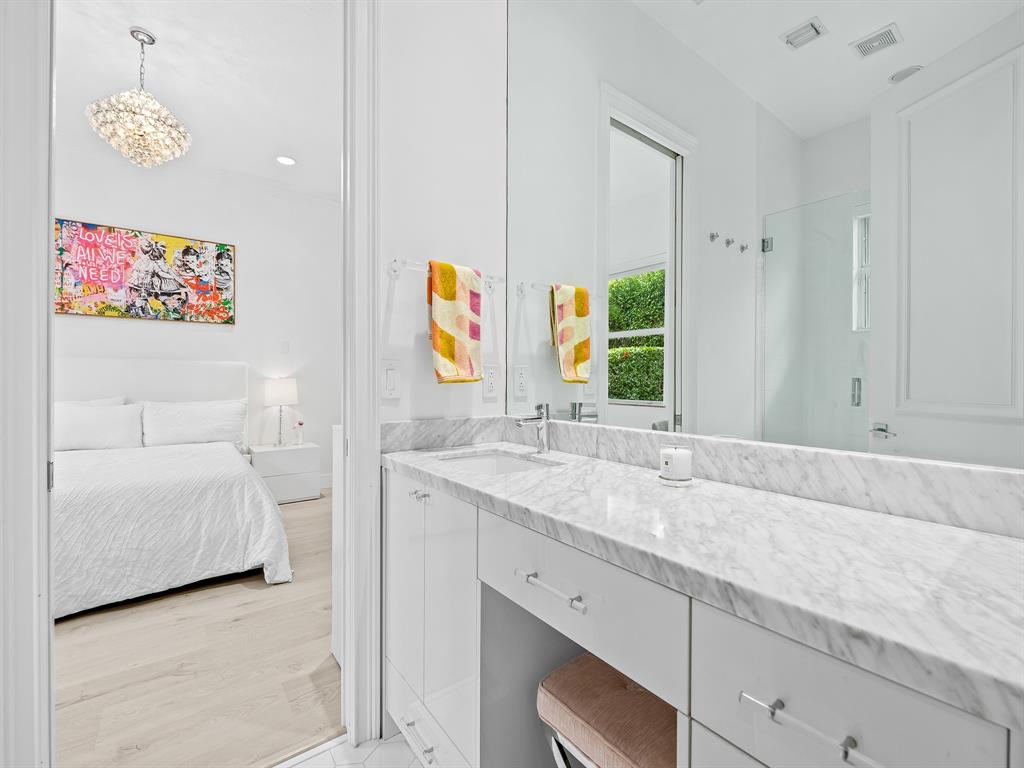 731 Coconut Palm Terrace Plantation, FL 33324 - Photo 23 of 48 a bathroom with a sink and a mirror