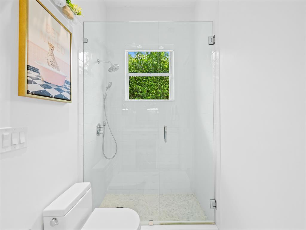 731 Coconut Palm Terrace Plantation, FL 33324 - Photo 24 of 48 a bathroom with a toilet and a shower