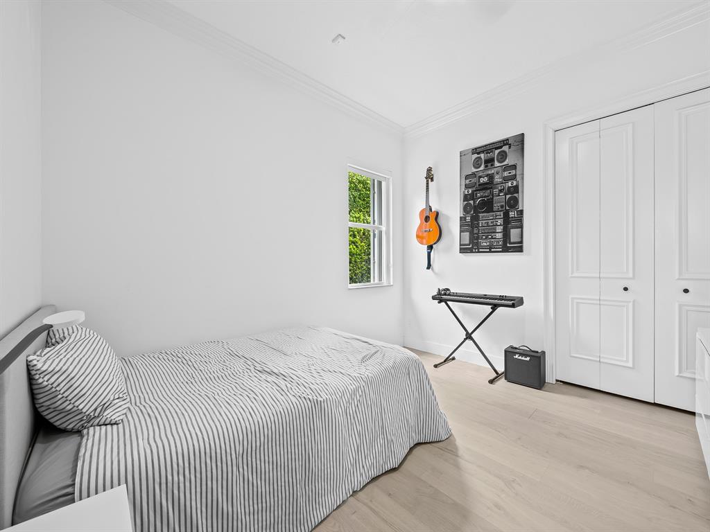 731 Coconut Palm Terrace Plantation, FL 33324 - Photo 27 of 48 a bedroom with a bed and a window