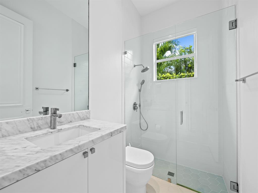 731 Coconut Palm Terrace Plantation, FL 33324 - Photo 28 of 48 a bathroom with a sink toilet and shower